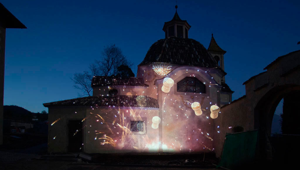 A projection mapping on a facade of the chapel used for the wedding ceremony.